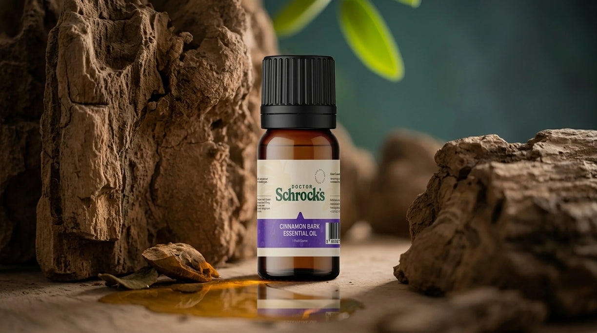 Dr. Schrock's Pure Cinnamon Bark Essential Oil bottle held in hand outdoors — pure 1oz cinnamon bark essential oil for daily use