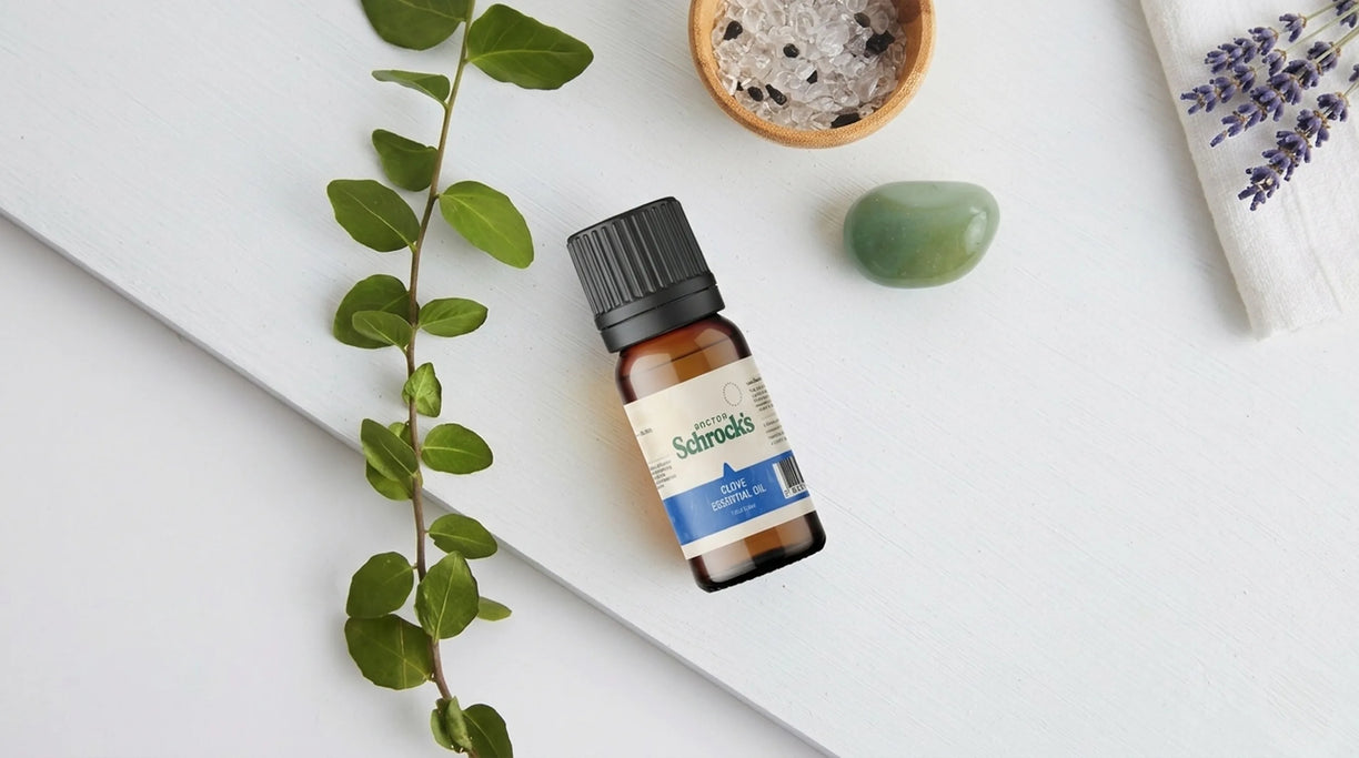 Dr. Schrock's Pure Clove Essential Oil bottle in real-world setting — essential oil from doctor with 40 years of practice